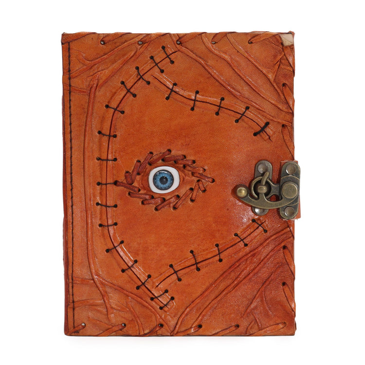 Cuaderno marrón claro con ojo turco y bordes desgastados